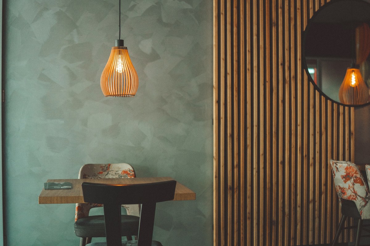 Warm restaurant interior with glowing pendant lamps